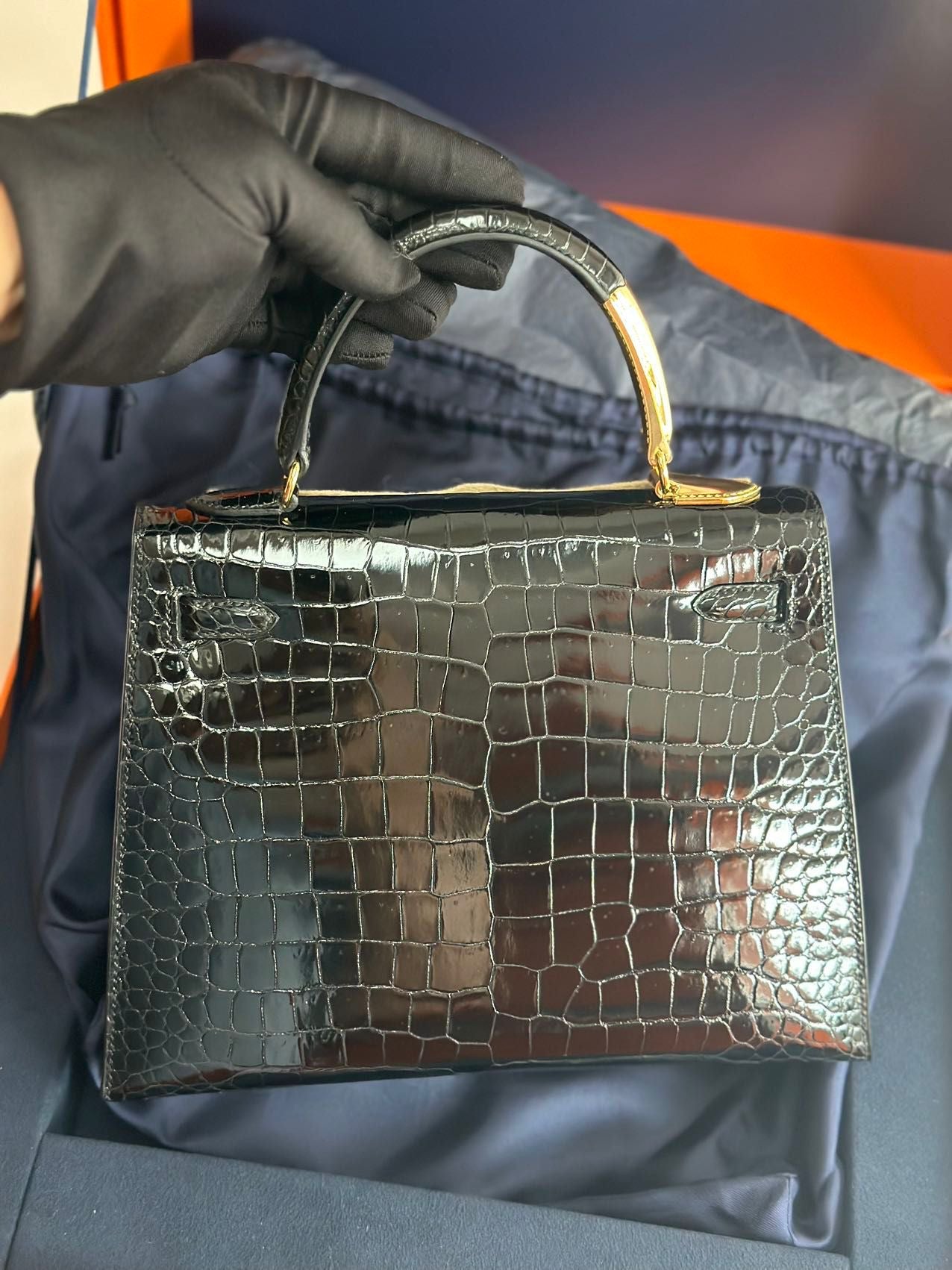 Hermès Kelly Midas 25 Noir Shiny Crocodile Porosus 18k yellow gold hardware  handle