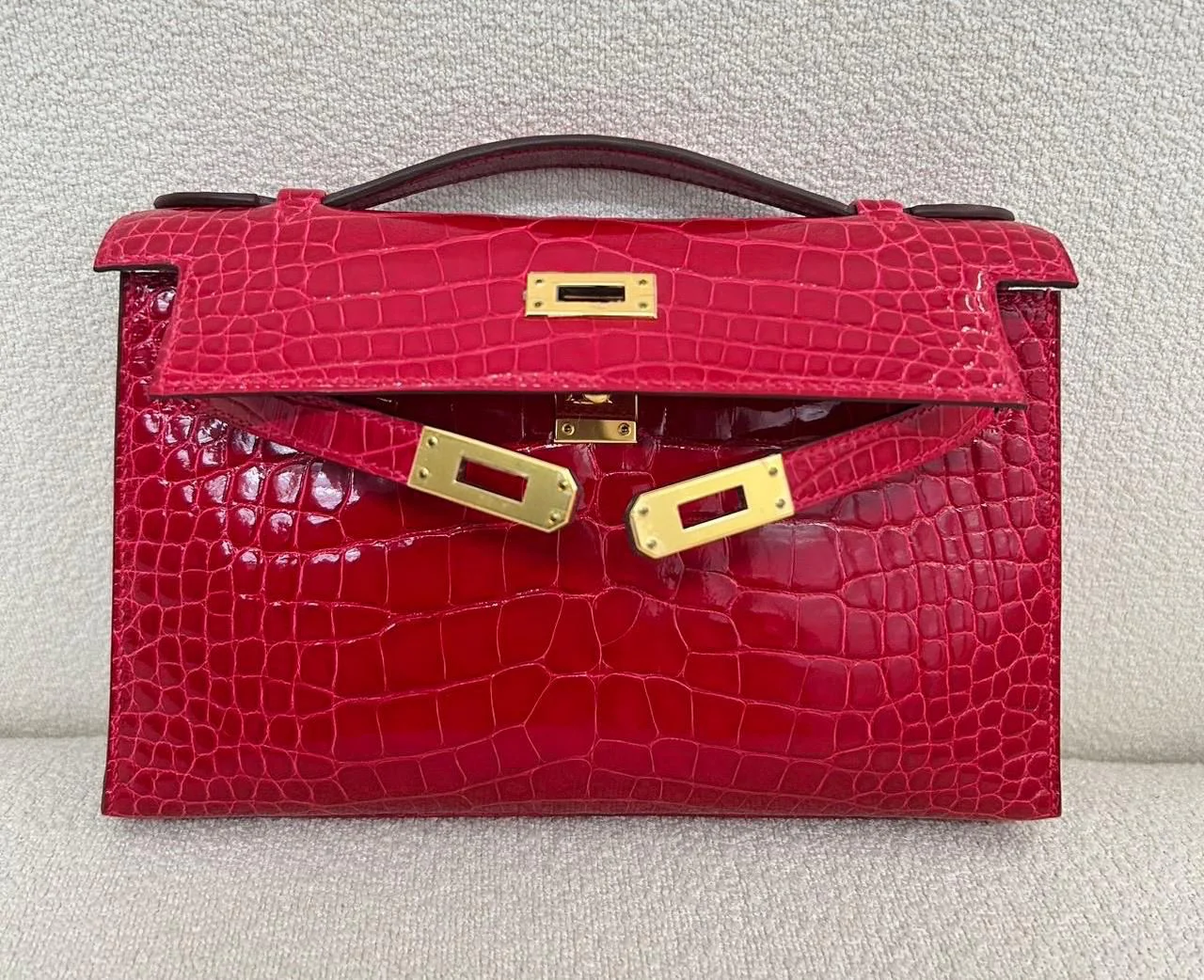 Hermes Kelly Pochette Braise Shiny Alligator Gold hardware