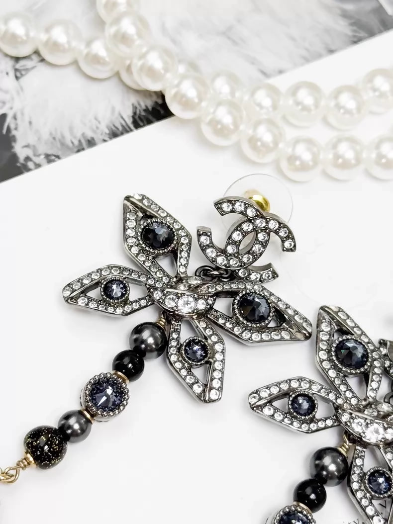 Chanel Métiers dArt silver butterfly long stud earrings