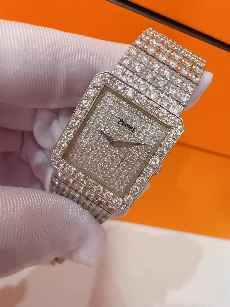 Vintage Piaget mens watch with diamond-set bezel and bracelet, quartz movement