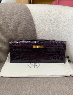 Hermès Kelly Cut Amethysts shiny Crocodile with gold hardware Clutch