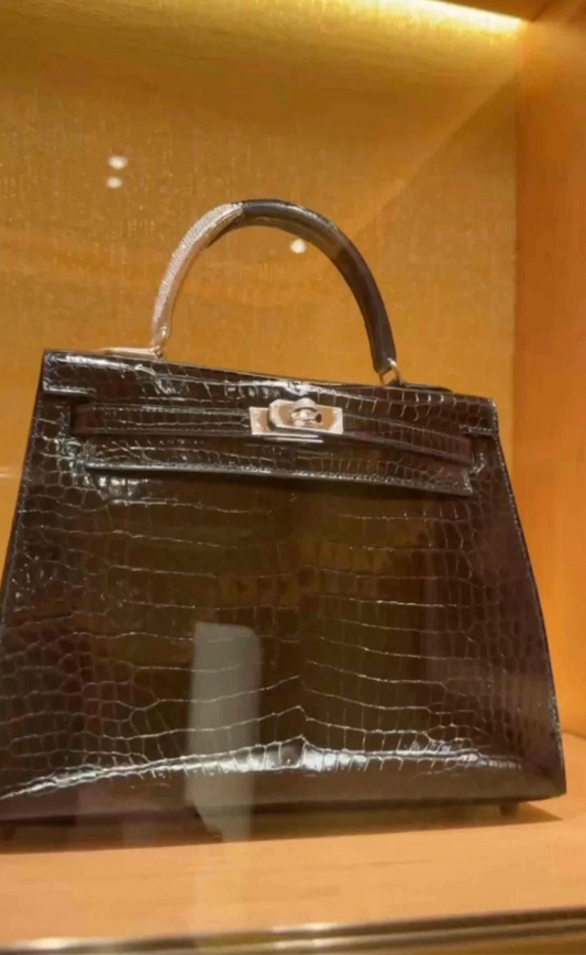 HERMES KELLY 25 MIDAS SHINY BLACK POROSUS CROCODILE SELLIER WITH 18K WHITE GOLD HARDWARE  DIAMOND HANDLE