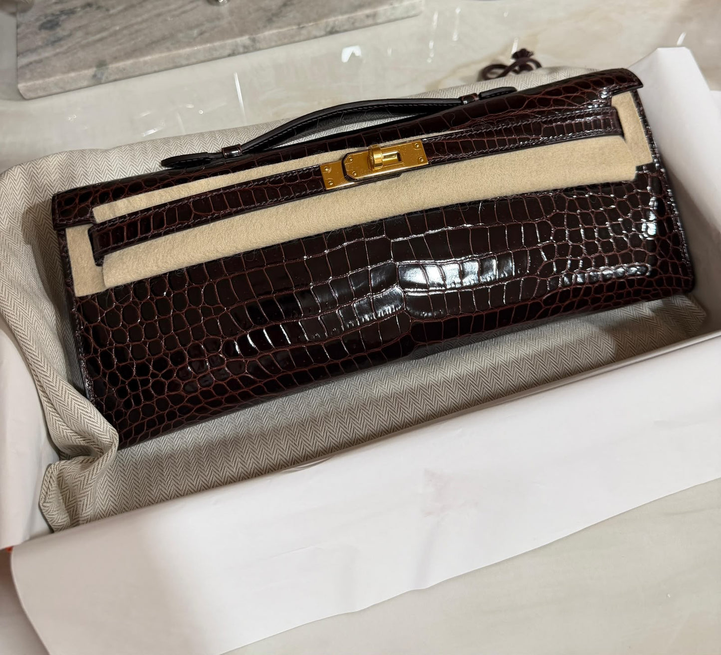 Hermès Kelly Cut Havane Shiny Porosus Gold hardware