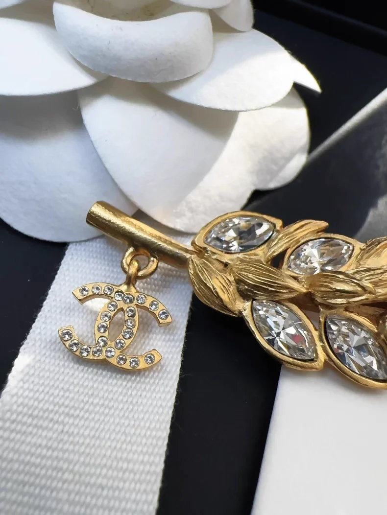Chanel 20A gold rhinestone wheat logo pendant brooch