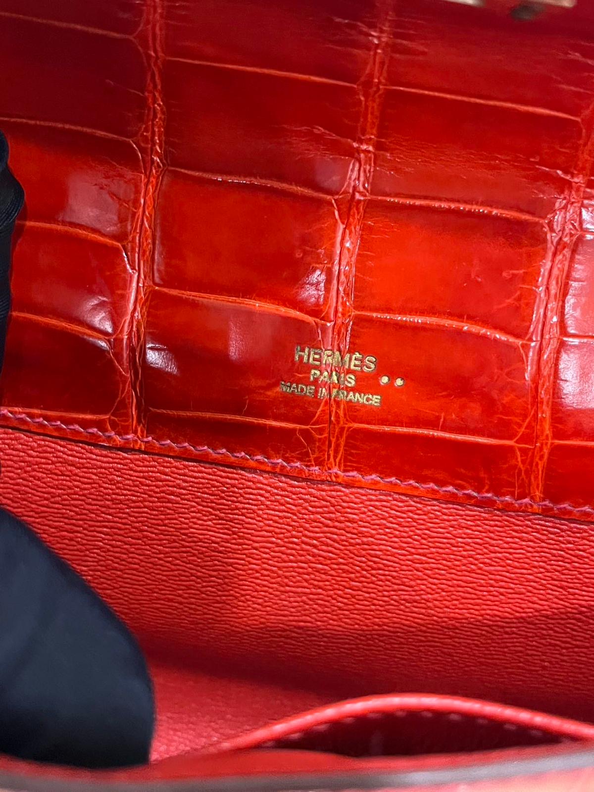 Hermes Kelly cut red shiny crocodile leather gold hardware
