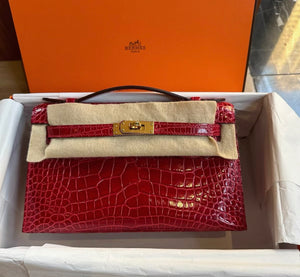 Hermes Kelly Pochette Red shiny crocodile leather gold hardware