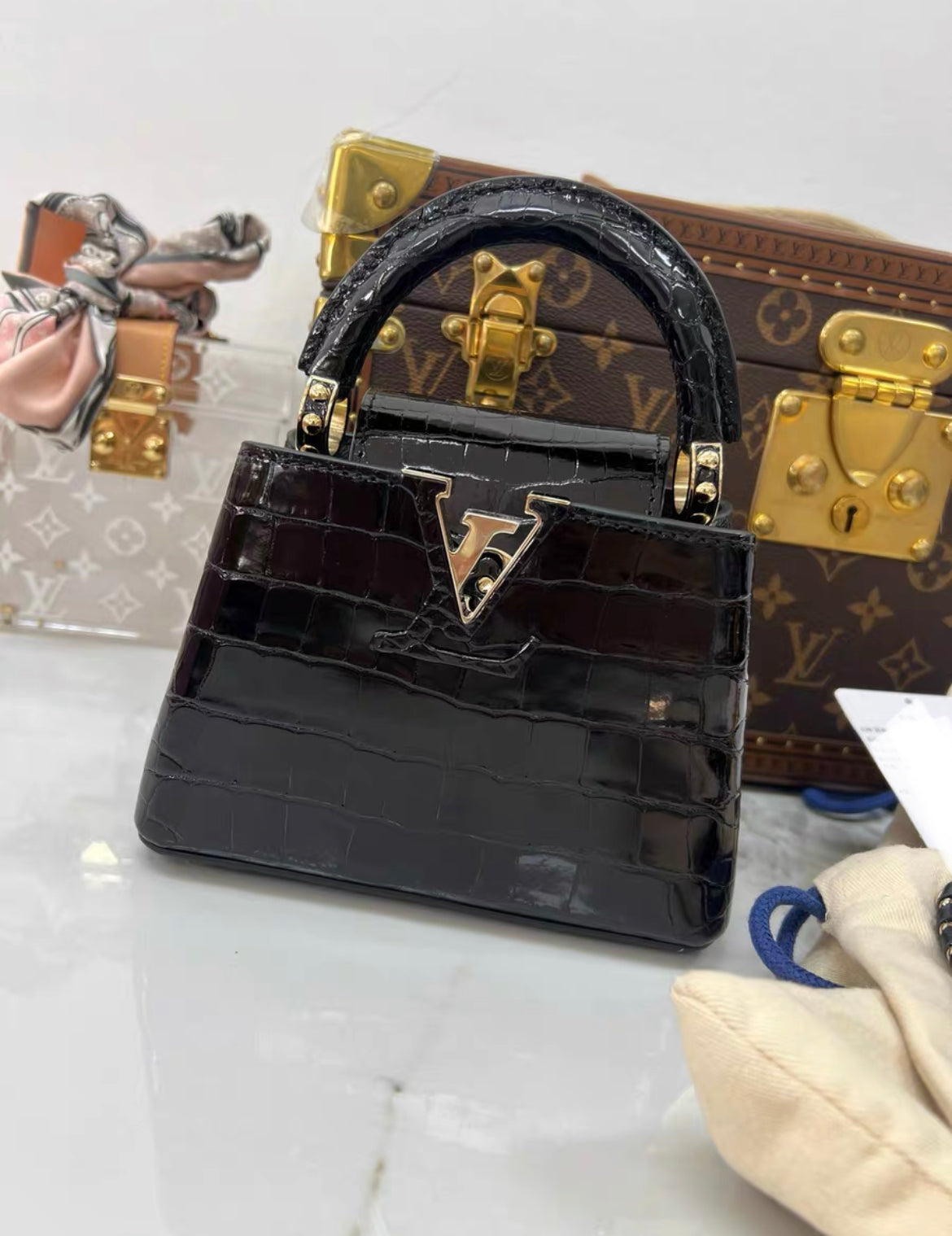 LOUIS VUITTON BLACK MINI CAPUCINES BB HANDBAG IN SHINY ALLIGATOR LEATHER WITH GOLD HARDWARE