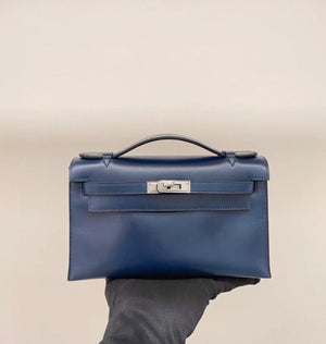 Hermès Kelly pochette Prussian Blue box leather guilloche hardware