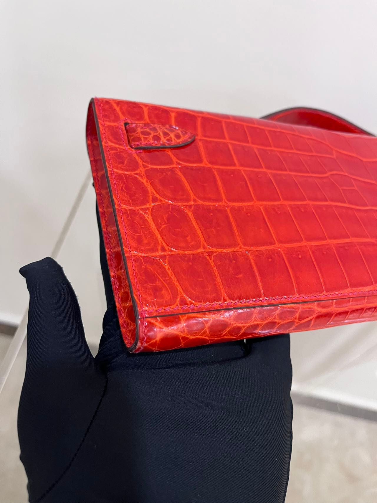 Hermes Kelly cut red shiny crocodile leather gold hardware