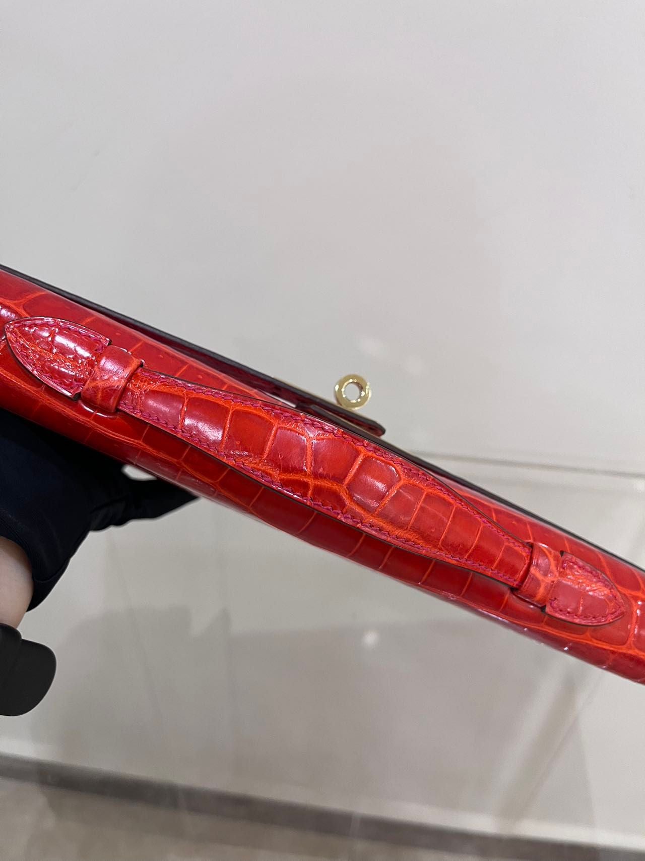 Hermes Kelly cut red shiny crocodile leather gold hardware