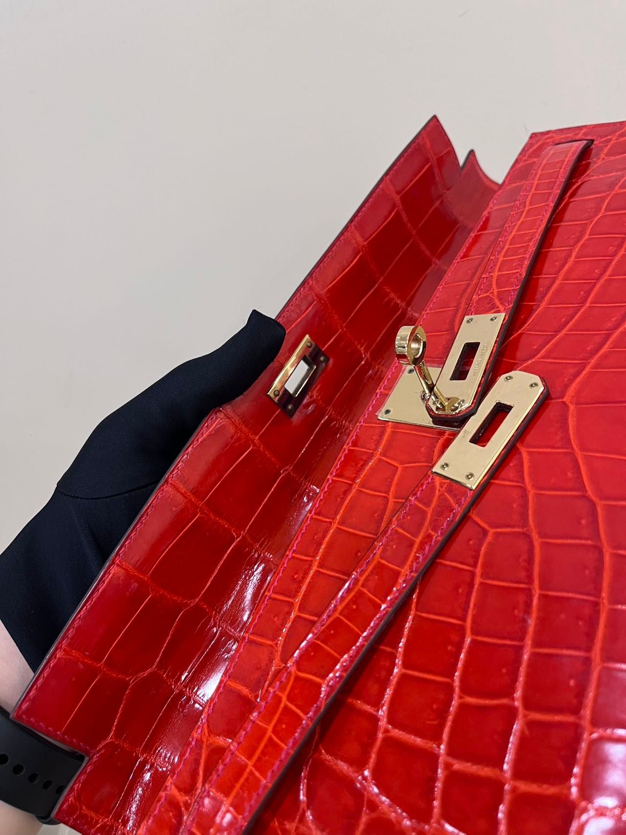 Hermes Kelly cut red shiny crocodile leather gold hardware