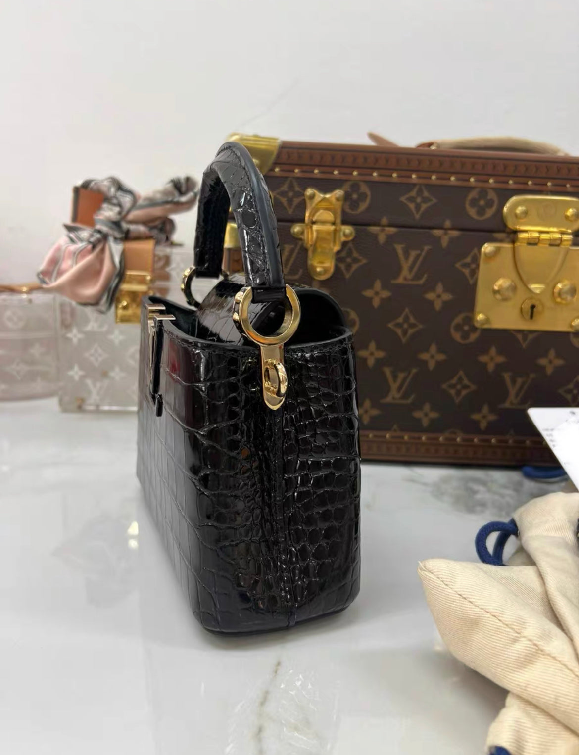 LOUIS VUITTON BLACK MINI CAPUCINES BB HANDBAG IN SHINY ALLIGATOR LEATHER WITH GOLD HARDWARE