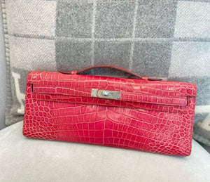 Hermès Kelly cut in Fuschia shiny porosus palladium hardware