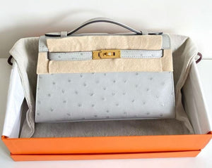 Hermès Kelly pochette blue glacier ostrich gold hardware