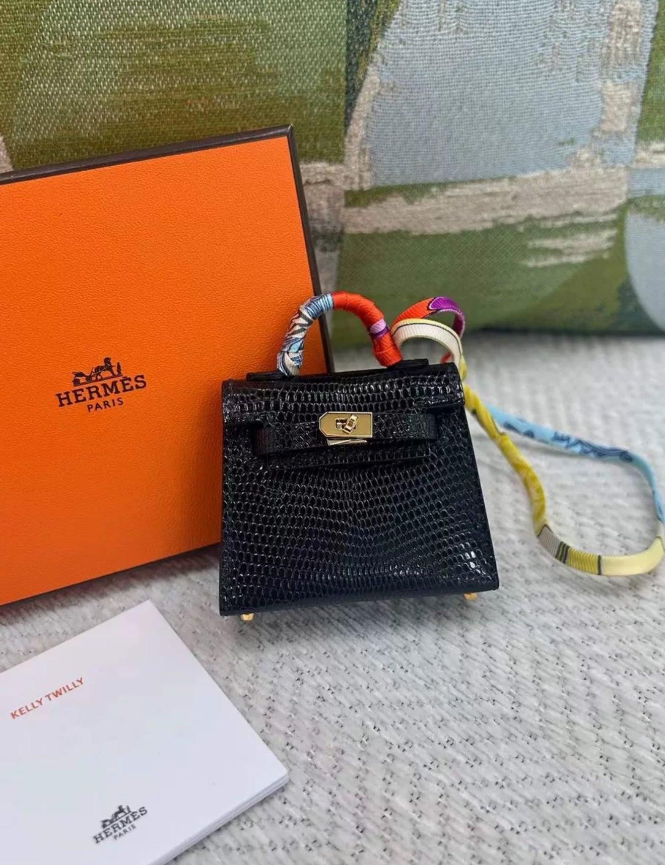 HERMÈS Kelly Twilly charm Noir Lizard Gold Hardware