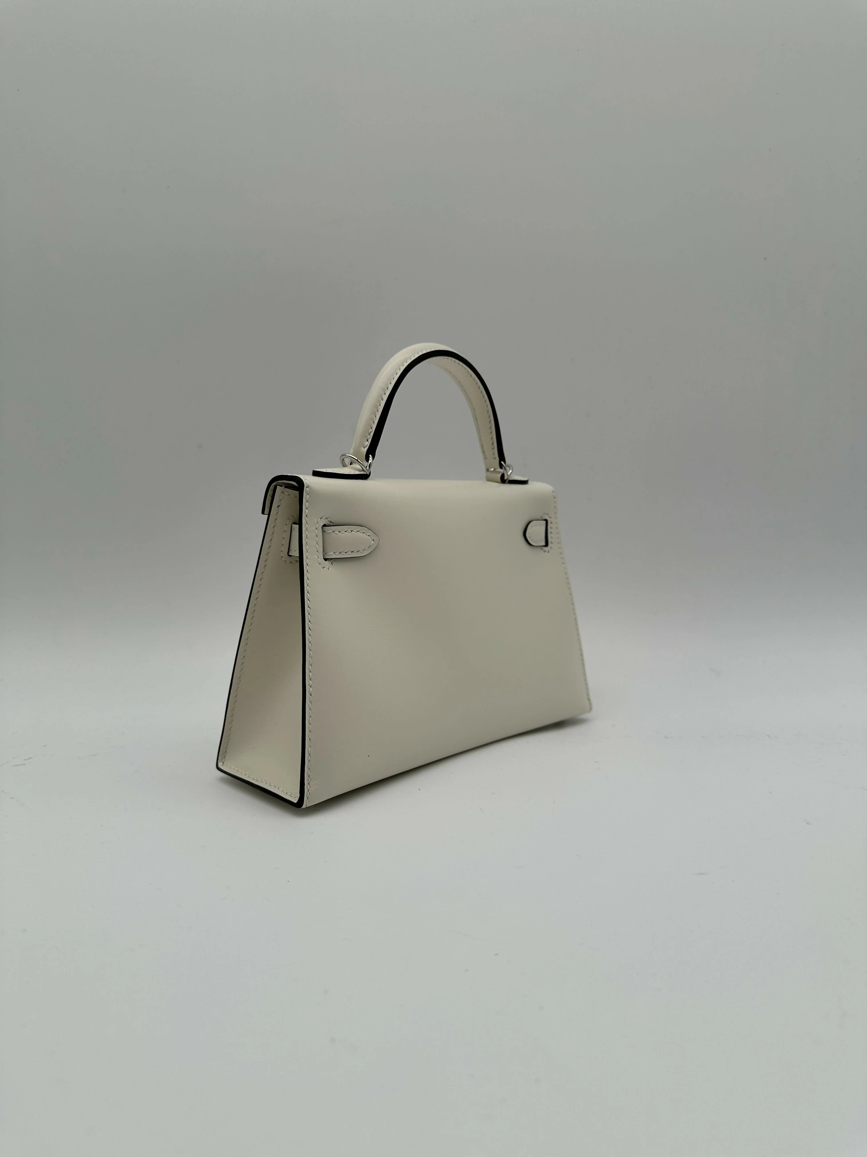 Hermès Kelly 20 Clouté Cream PHW G 2026