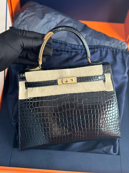 Hermès Kelly Midas 25 Noir Shiny Crocodile Porosus 18k yellow gold hardware  handle