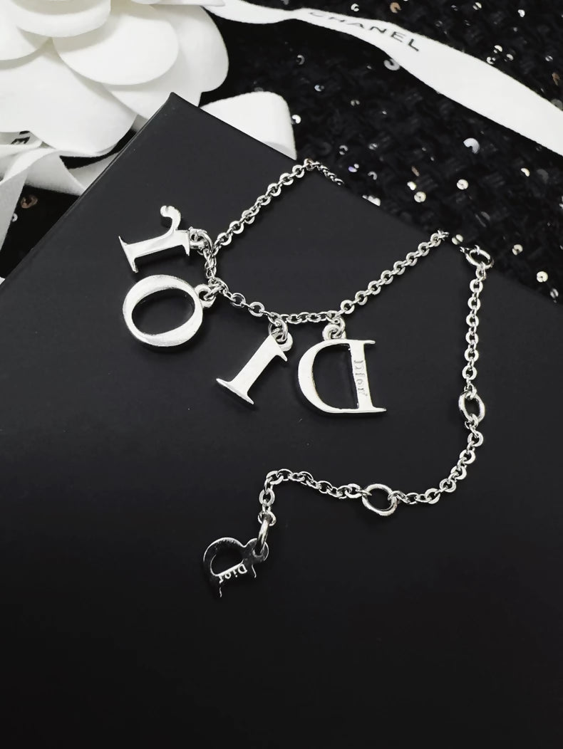 Dior bracelet with a letter pendant fully set with diamonds