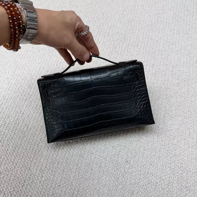 Hermes Kelly pochette black matte crocodile leather gold hardware