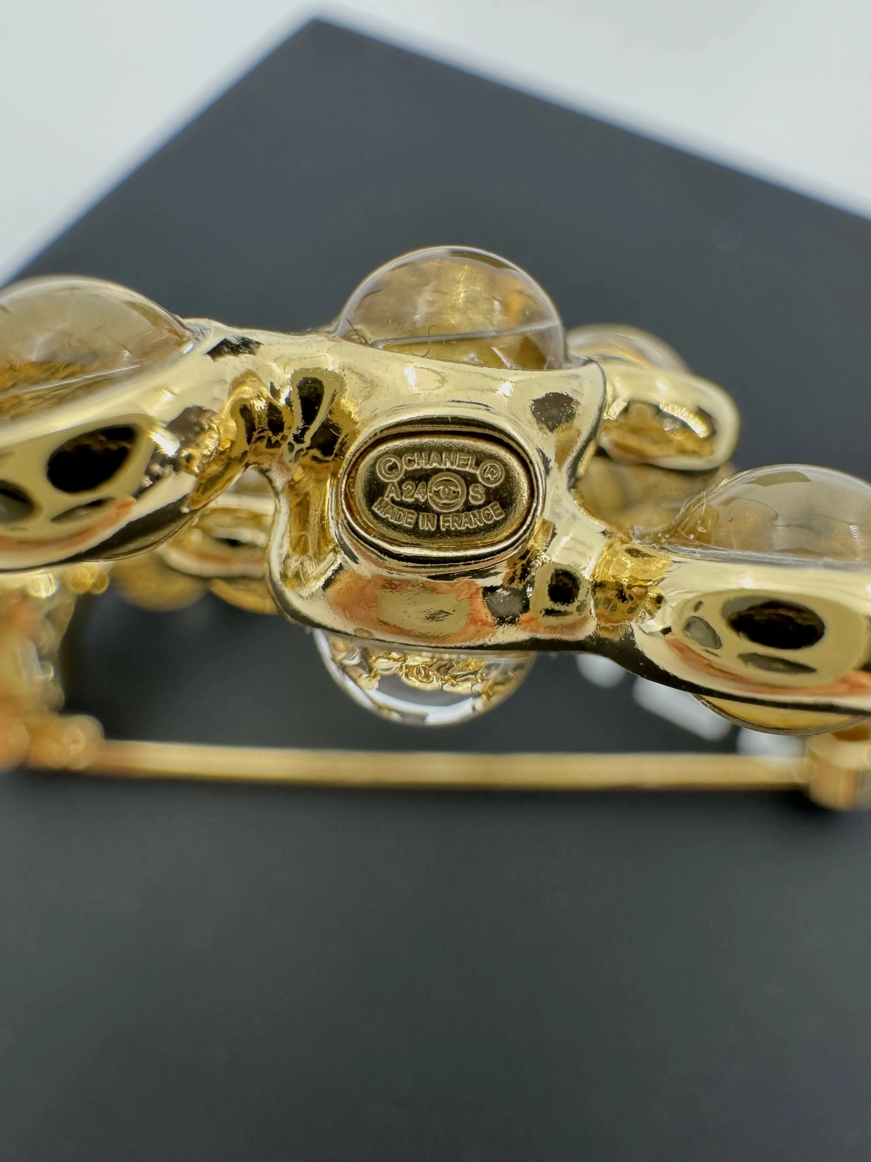 Chanel A24S Acrylic CC Champagne Gold Transparent Brooch