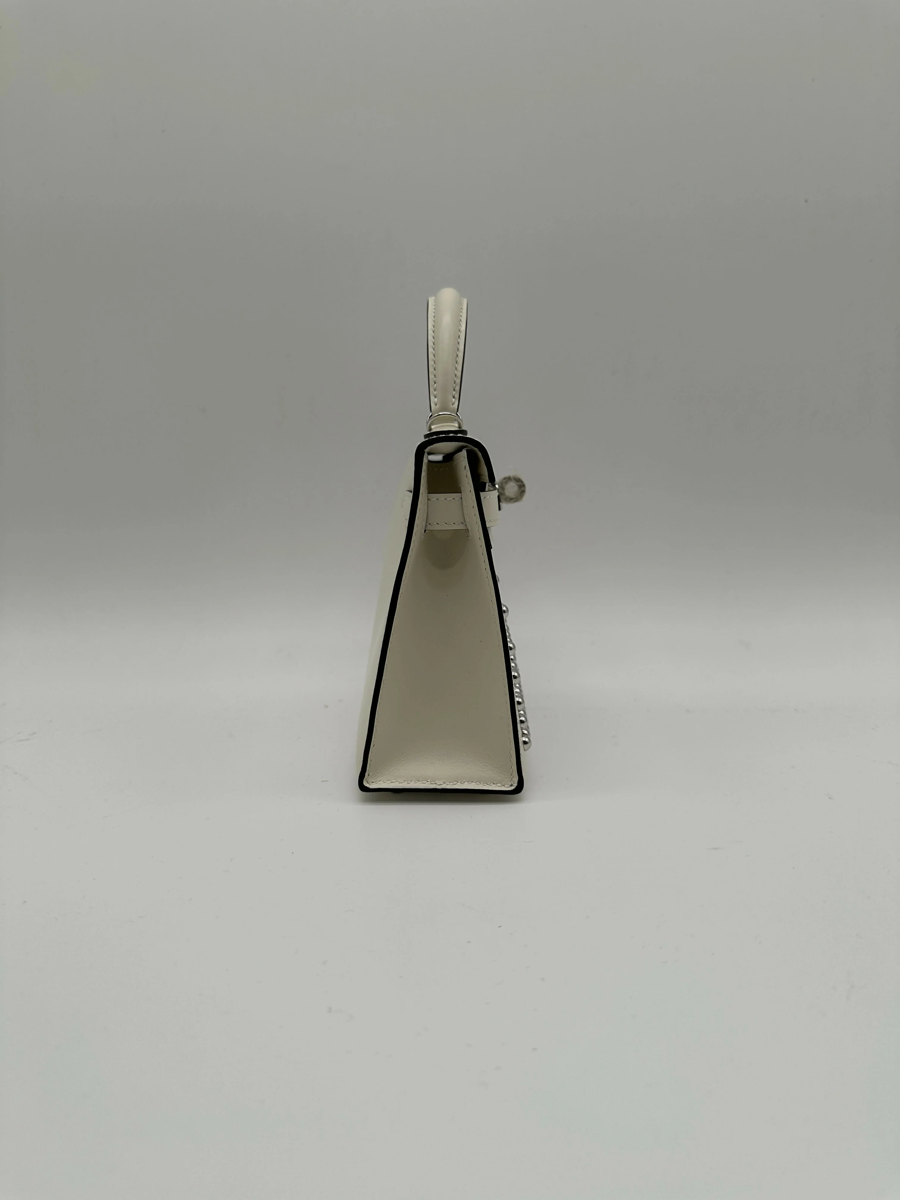 Hermès Kelly 20 Clouté Cream PHW G 2026