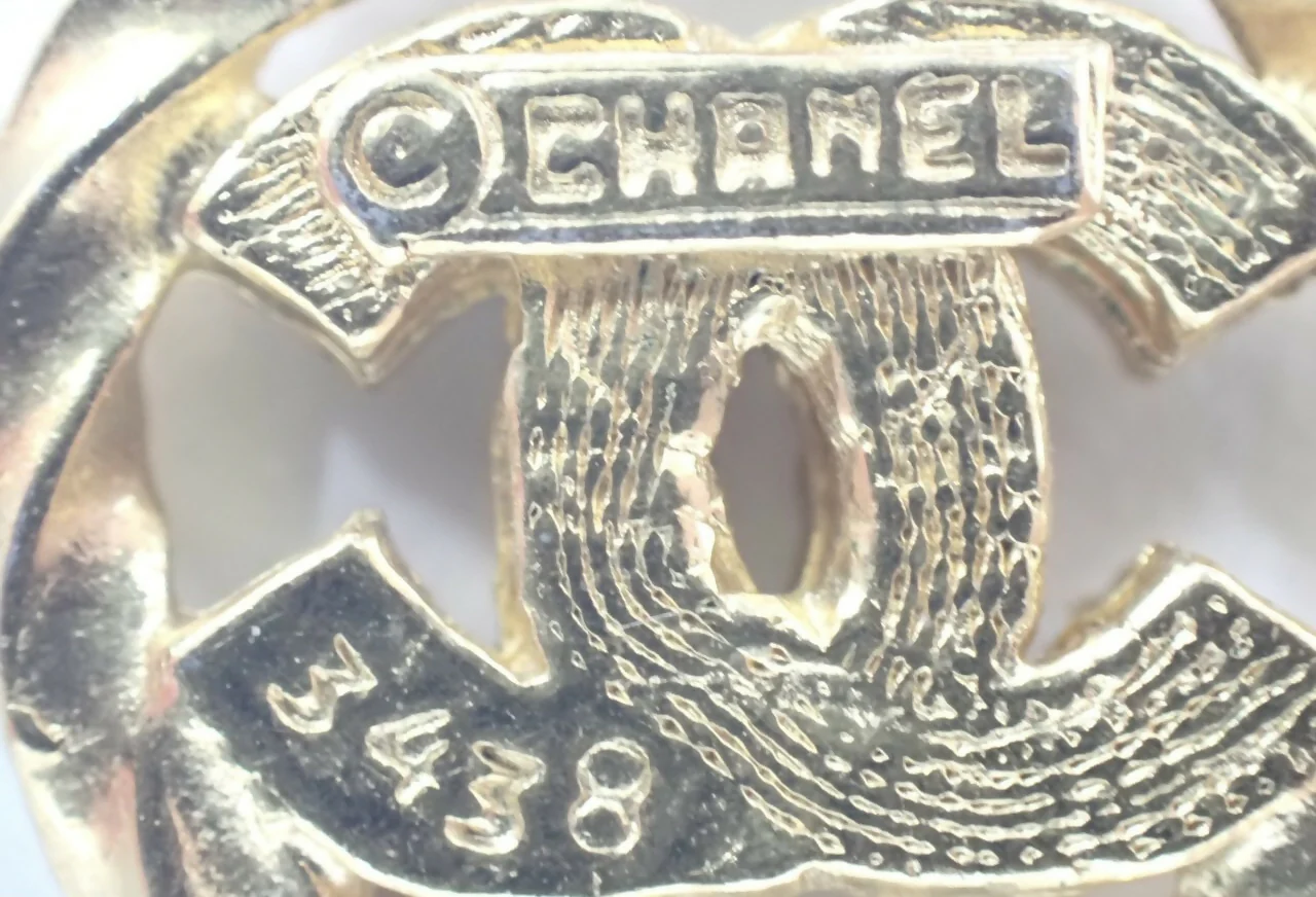 Chanel Vintage 1982 Rhinestone Gold Plated Braided Medallion Interlocking Coco Mark Necklace