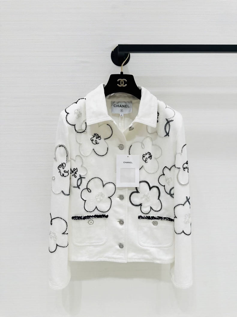 Chanel Métiers dArt white denim jacket with beaded camellia