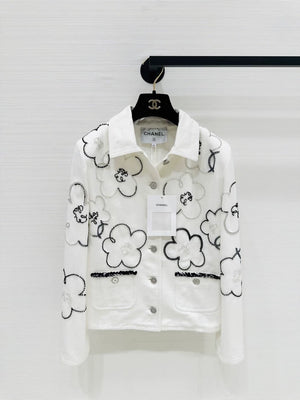 Chanel Métiers dArt white denim jacket with beaded camellia