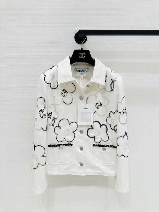 Chanel Métiers dArt white denim jacket with beaded camellia