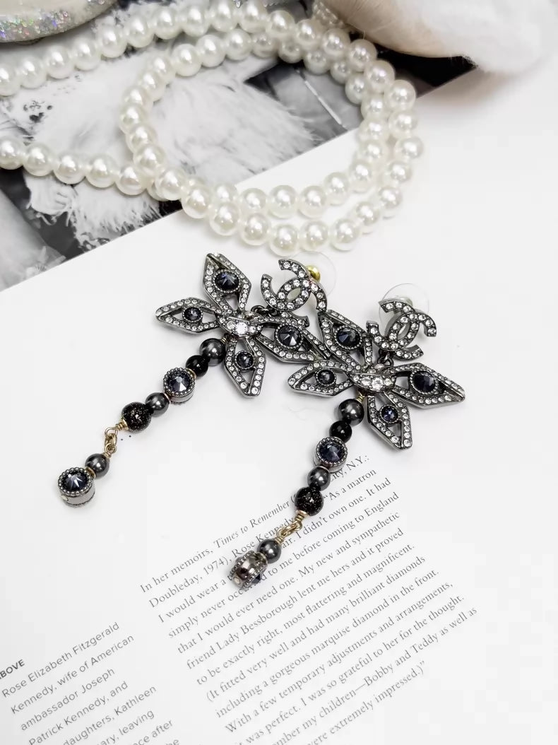 Chanel Métiers dArt silver butterfly long stud earrings