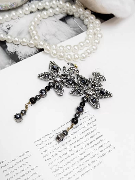 Chanel Métiers dArt silver butterfly long stud earrings
