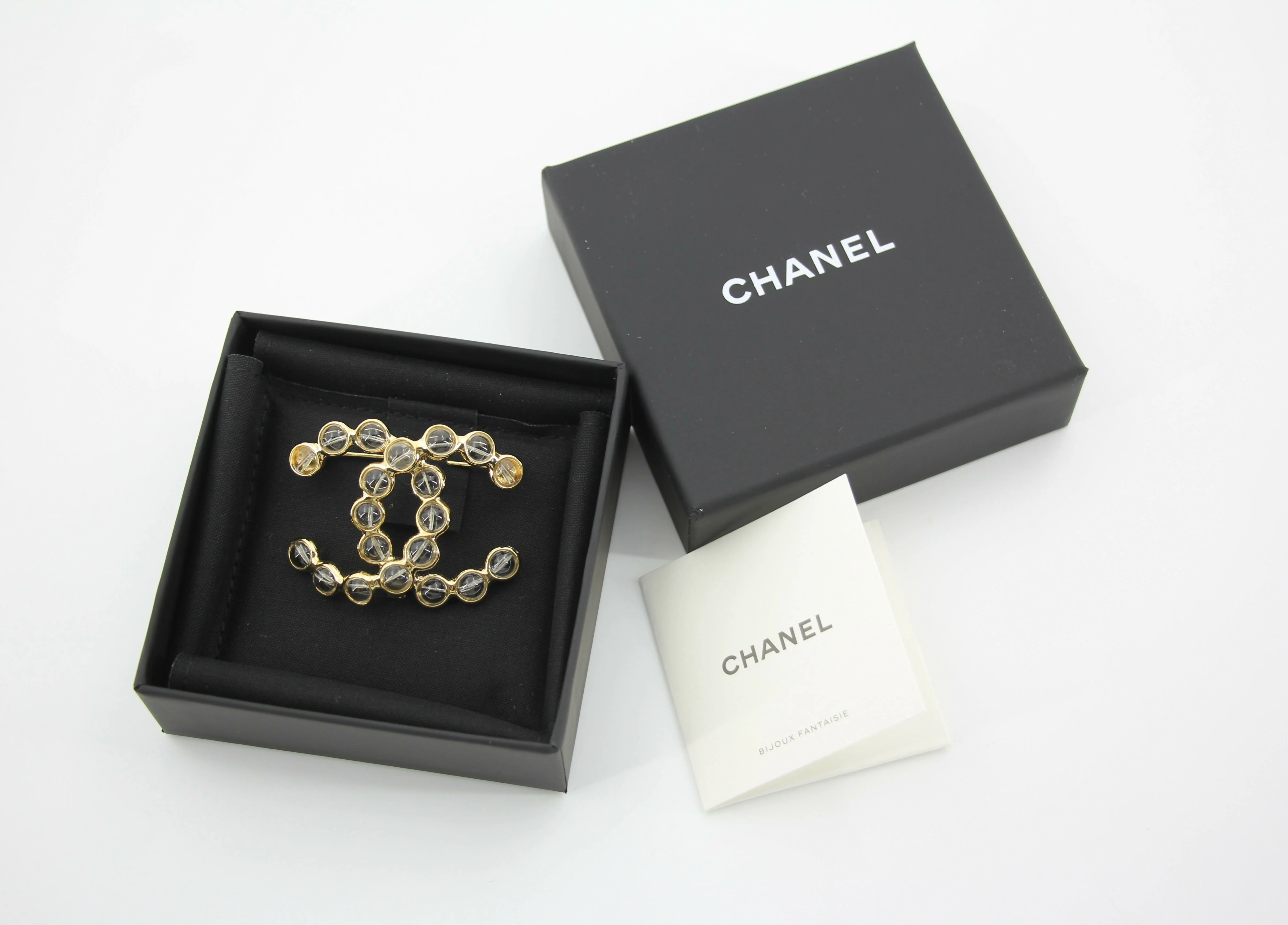Chanel A24S Acrylic CC Champagne Gold Transparent Brooch