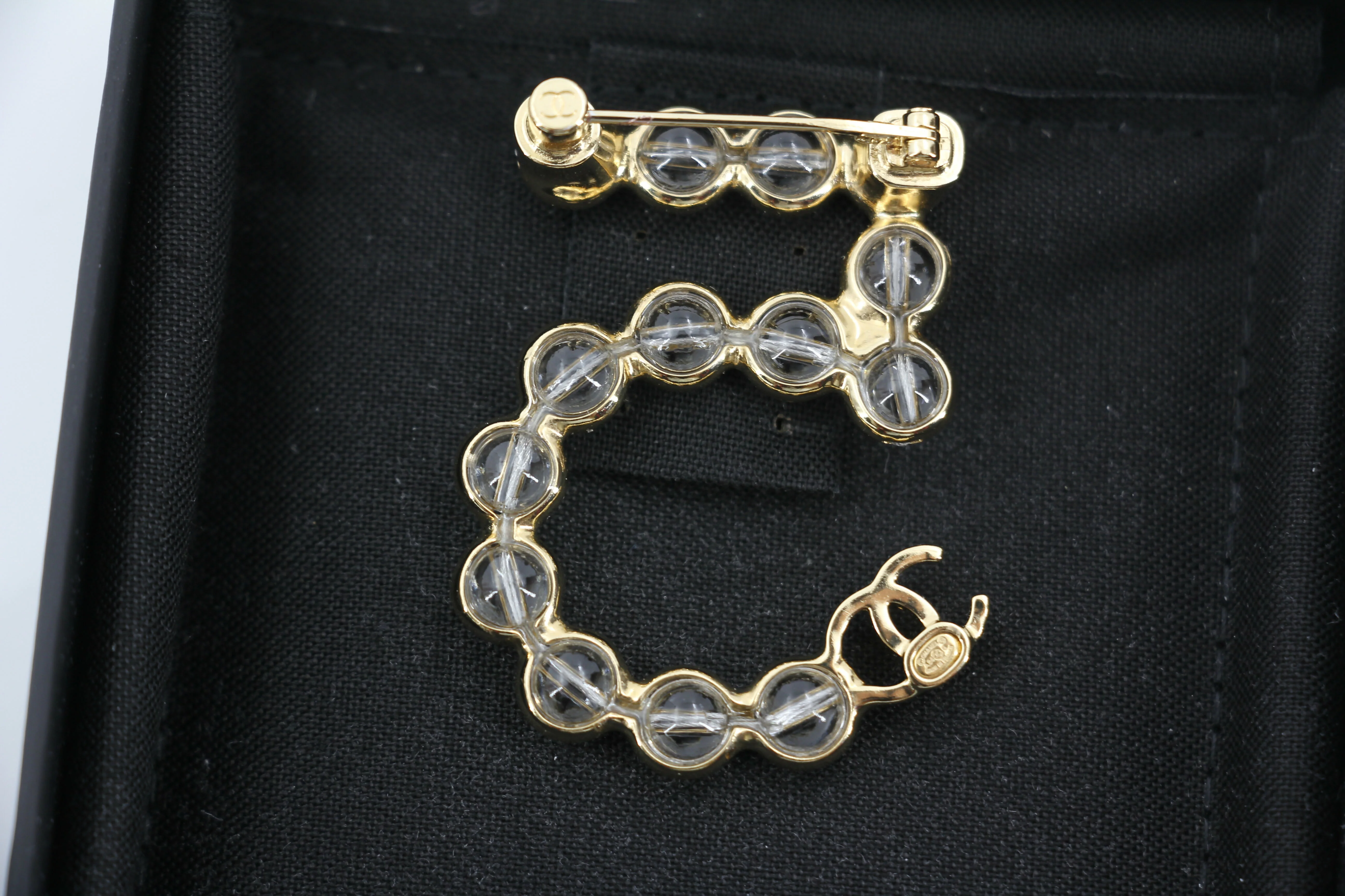 Chanel A24S Acrylic No. 5 Champagne Gold Transparent Brooch