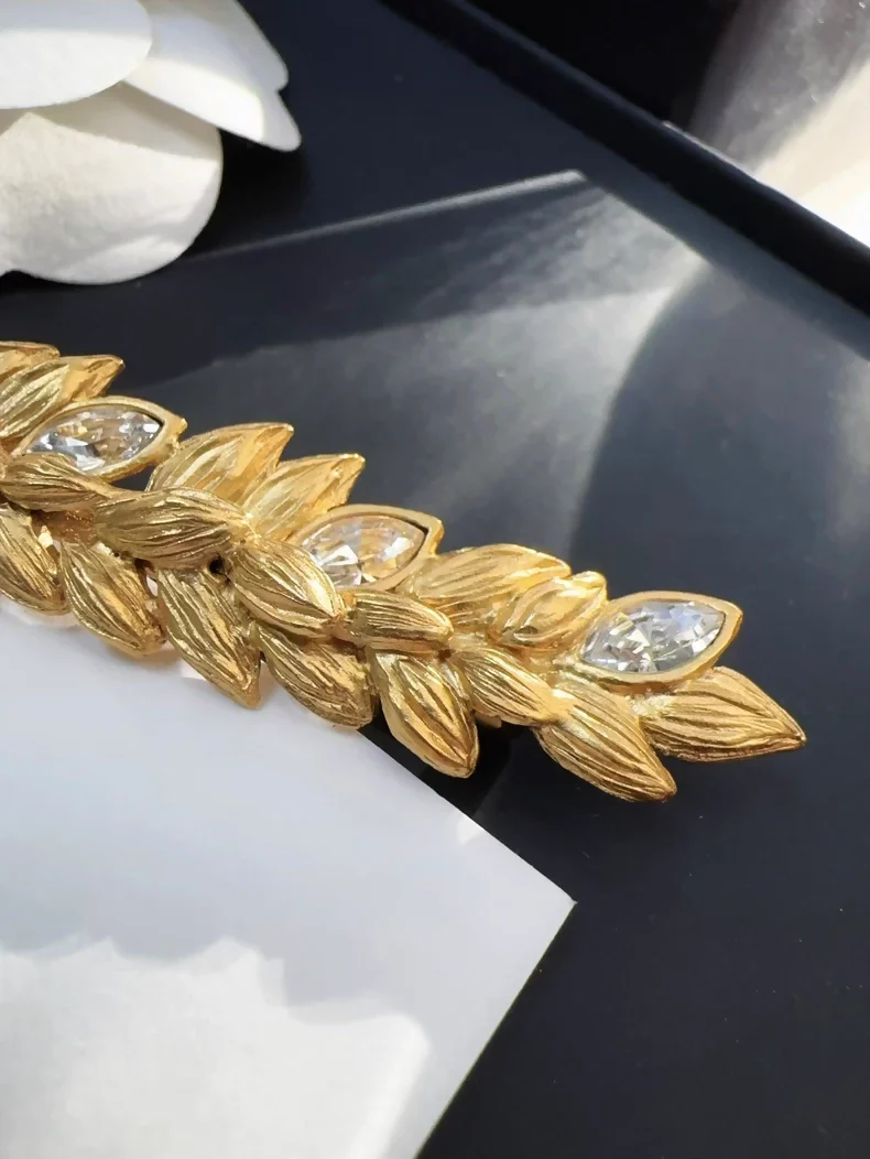 Chanel 20A gold rhinestone wheat logo pendant brooch