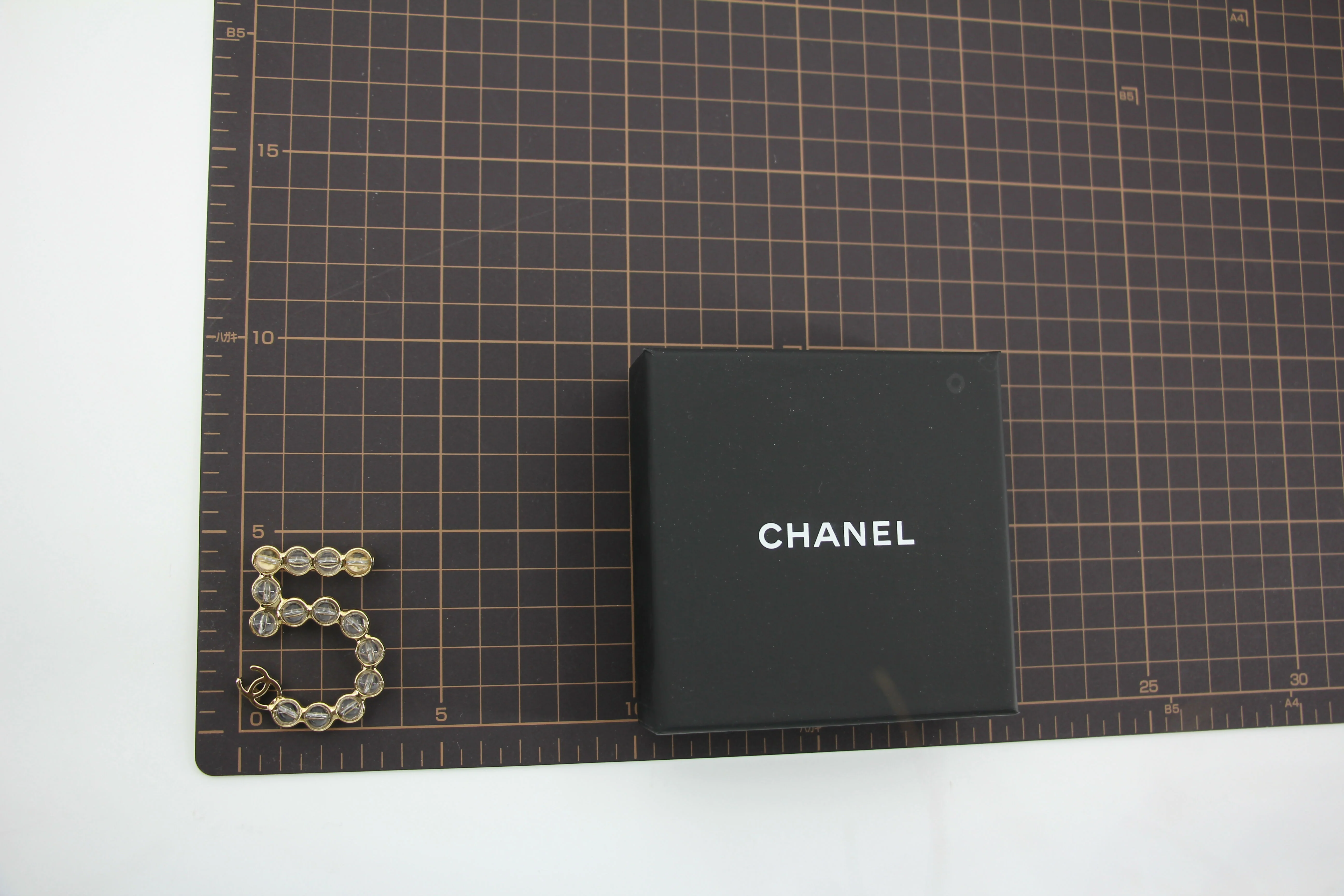 Chanel A24S Acrylic No. 5 Champagne Gold Transparent Brooch