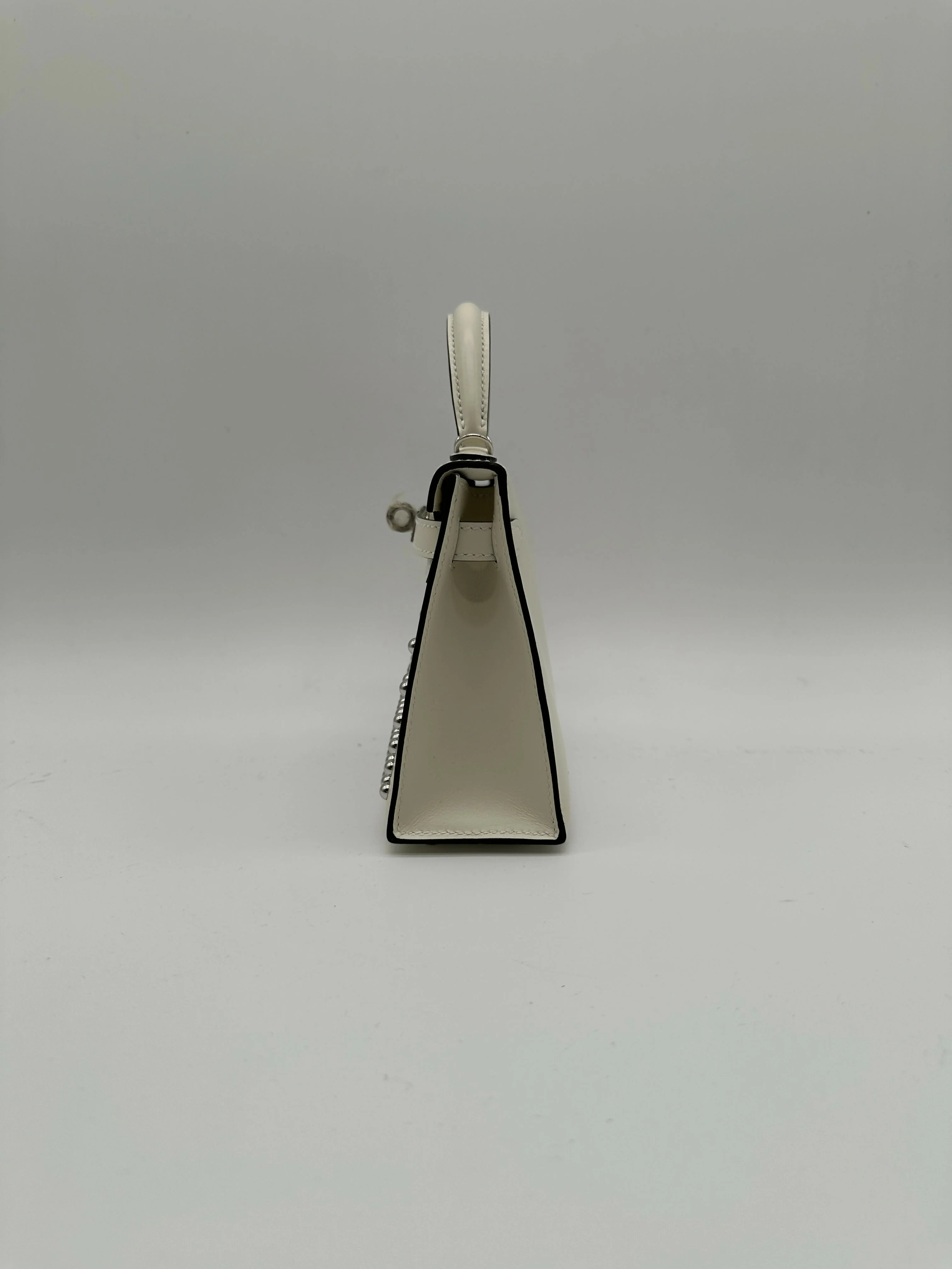 Hermès Kelly 20 Clouté Cream PHW G 2026