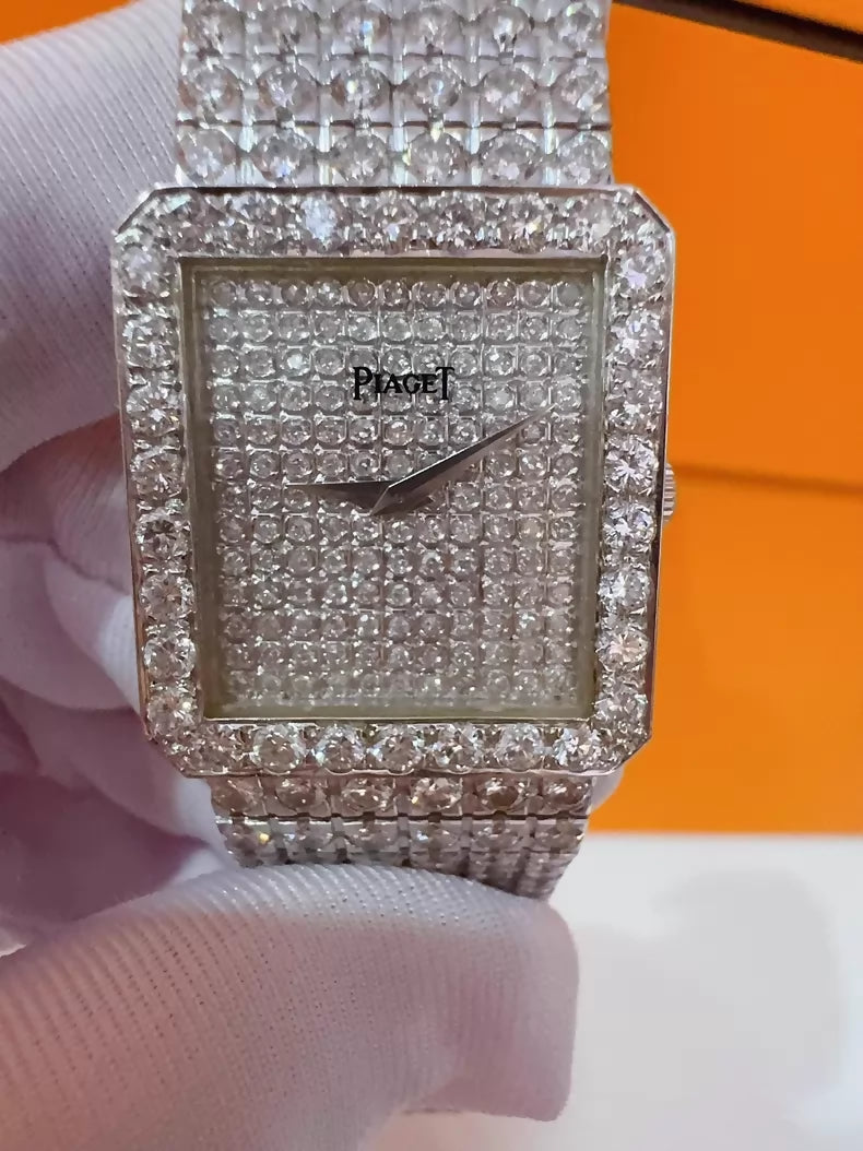 Vintage Piaget mens watch with diamond-set bezel and bracelet, quartz movement