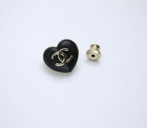 Chanel Vintage 22K Pale Gold Metal And Black Leather Heart Shape Round Buckle Brooch