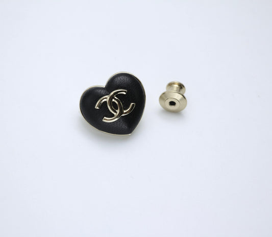 CHANEL Chanel Vintage 22K Pale Gold Metal And Black Leather Heart Shape Round Buckle Brooch - Onesize Fashion Jewellery - Vintage fashion from Top Quality Luxury Designers Bag