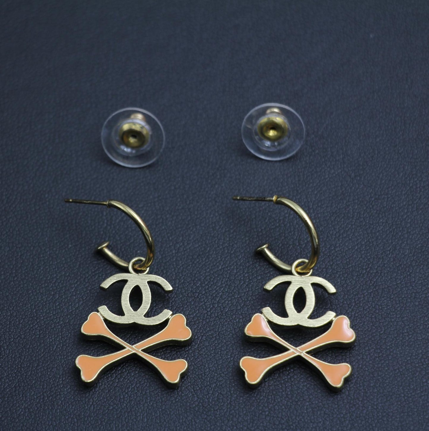 Chanel Vintage 03P Enamel Skull Orange Earrings