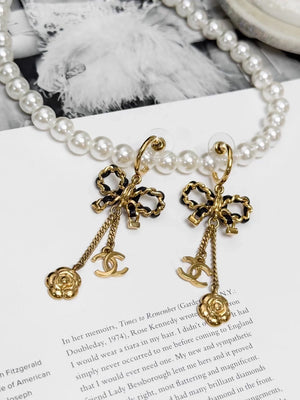 Chanel Métiers dArt black and gold leather chain with bow earrings