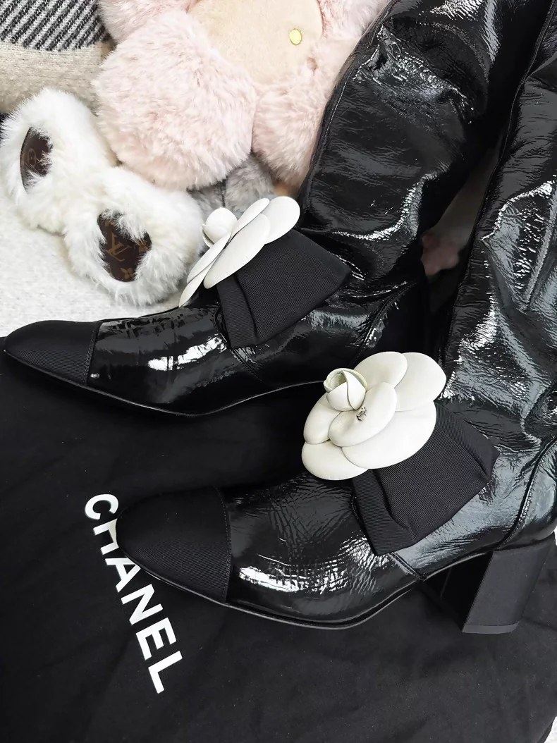 Chanel 23k black patent leather boots