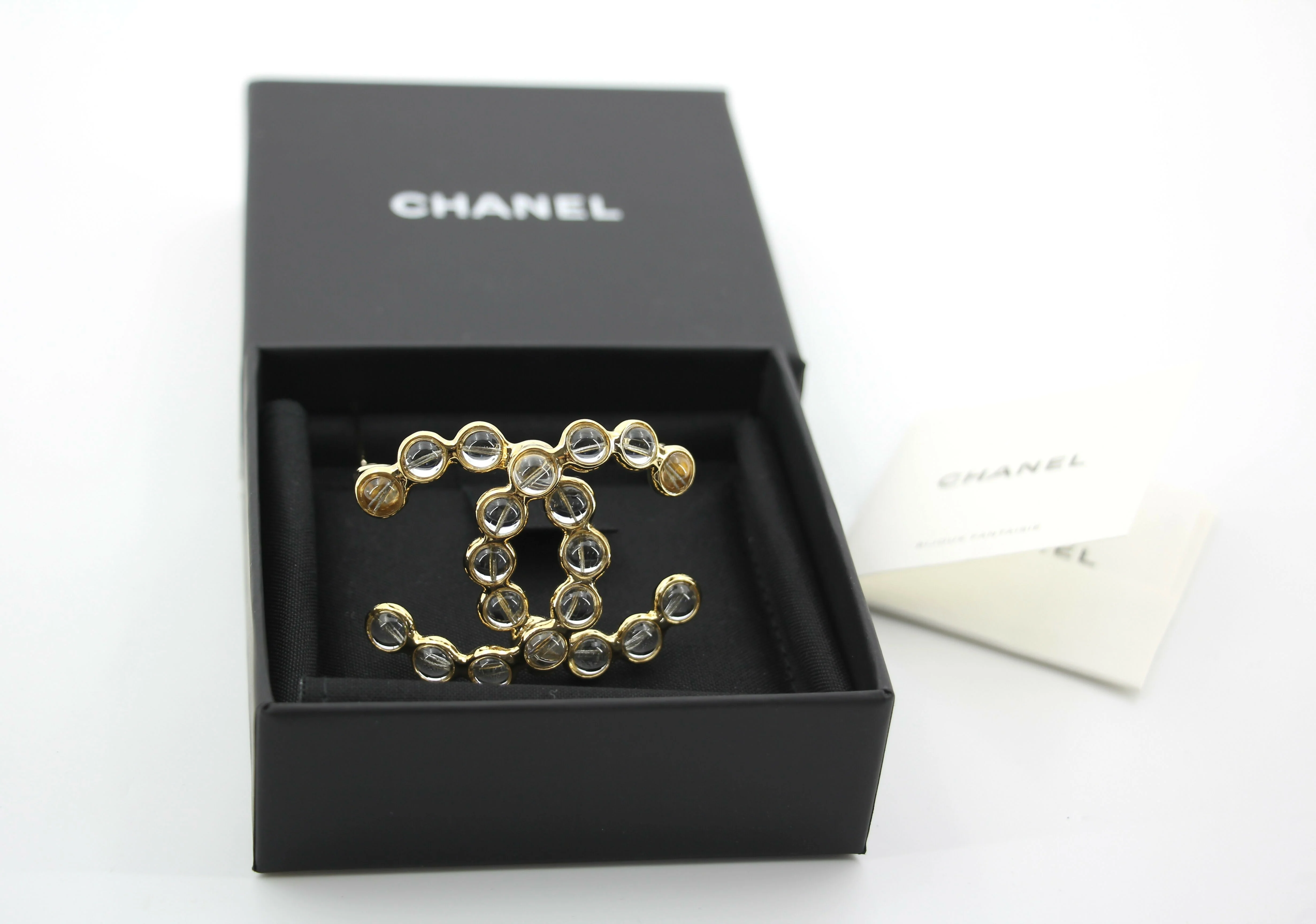 Chanel A24S Acrylic CC Champagne Gold Transparent Brooch
