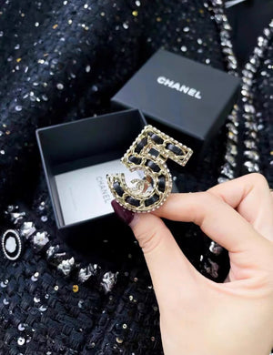 Chanel leather and metal number 5 ring