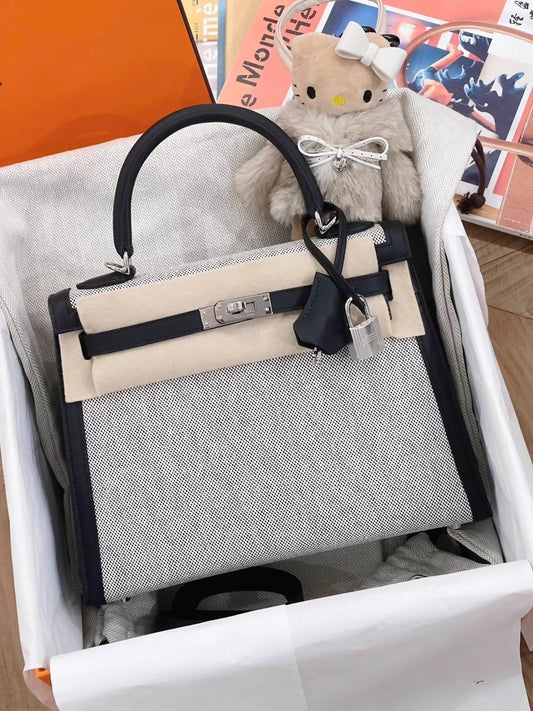 Hermès Kelly 25 black swift leather and Grey canvas palladium hardware