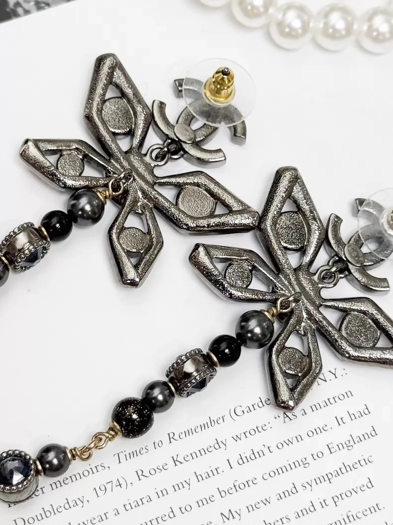 Chanel Métiers dArt silver butterfly long stud earrings