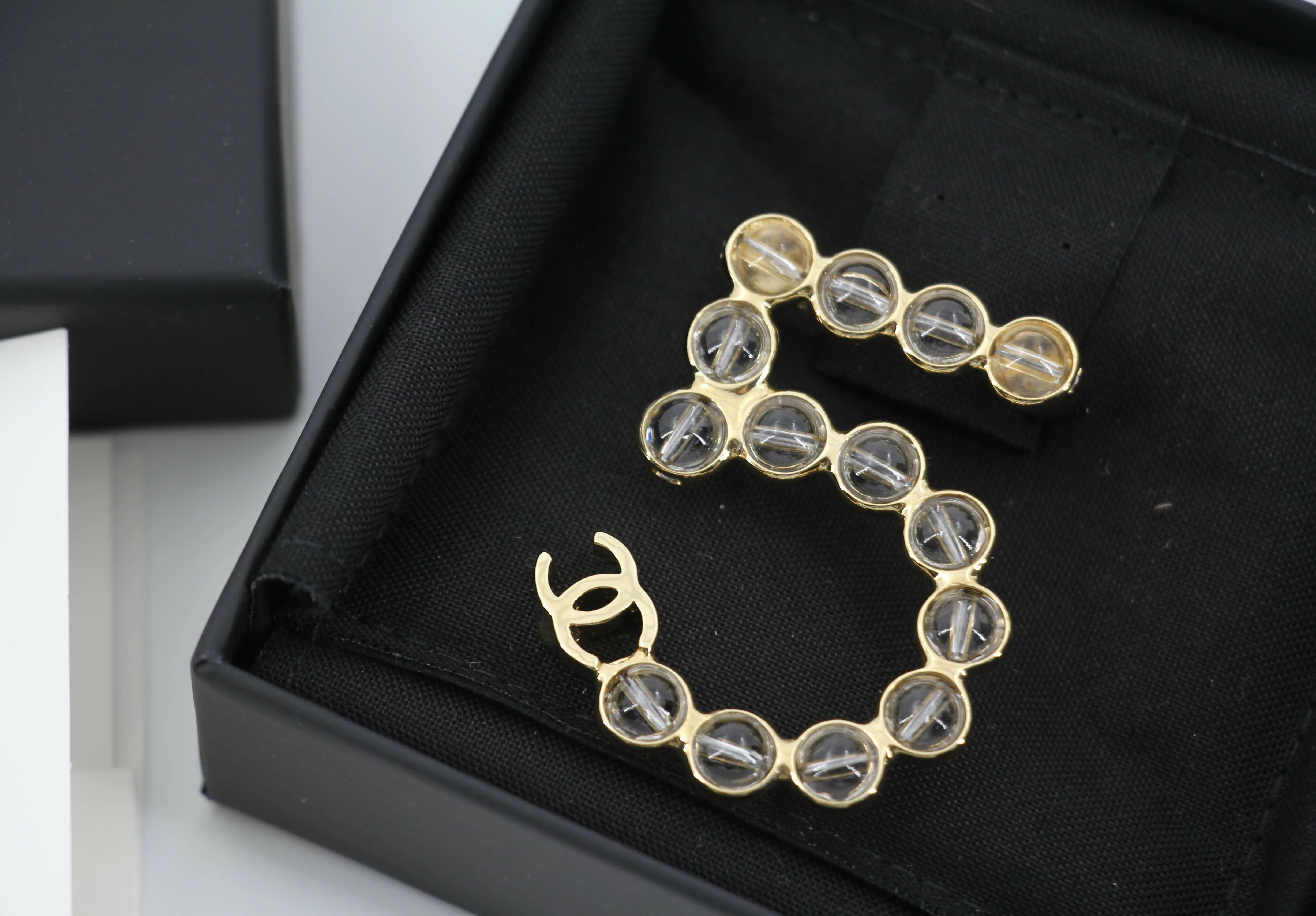 Chanel A24S Acrylic No. 5 Champagne Gold Transparent Brooch