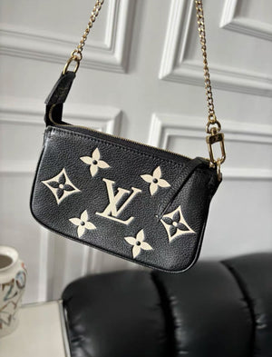 Louis Vuitton Bicolor Monogram Empreinte Leather Mini Pochette Accessoires