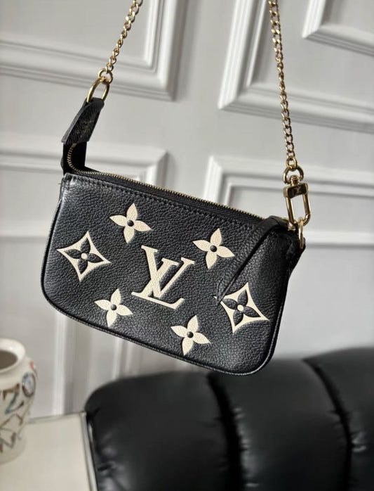 LOUIS VUITTON Louis Vuitton Bicolor Monogram Empreinte Leather Mini Pochette Accessoires - Small Clutch Bag - Used fashion item from Top Quality Luxury Designers Bag
