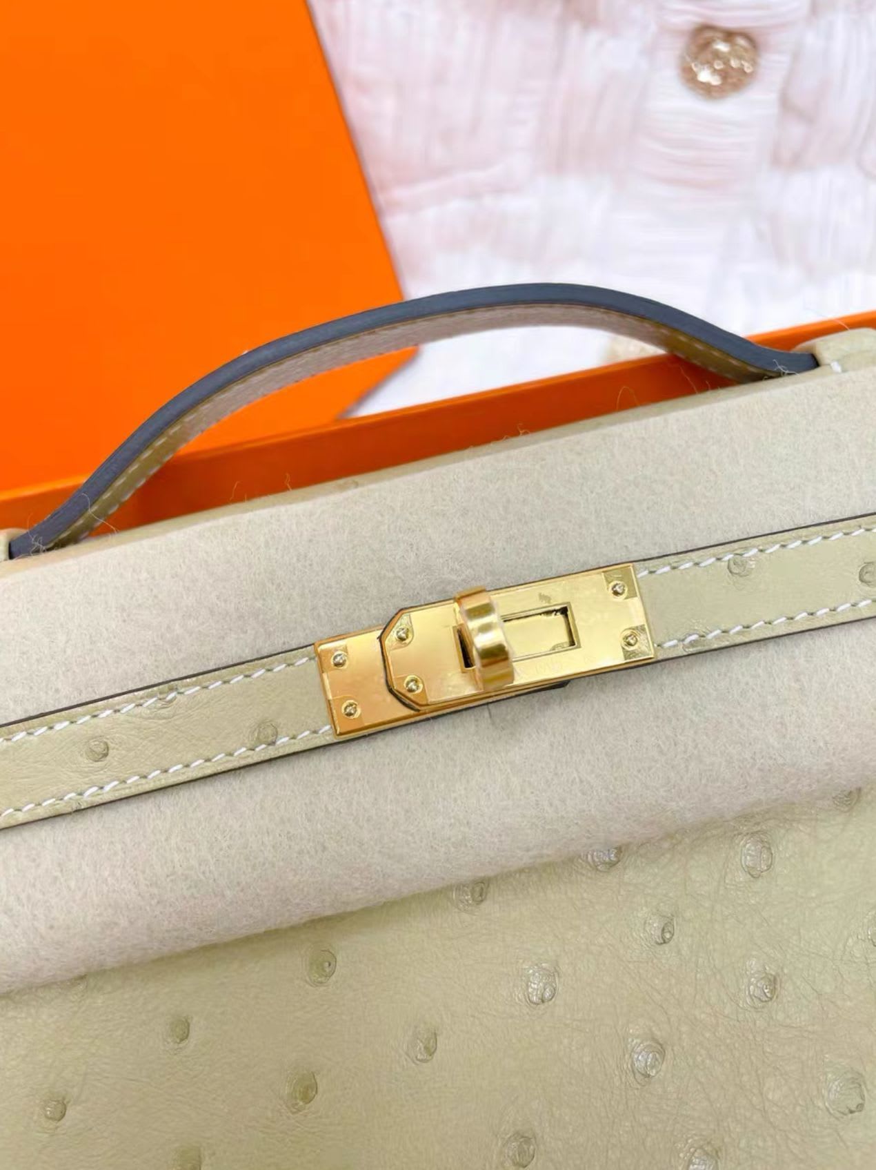 Hermes kelly Pochette ostrich leather  gold hardware